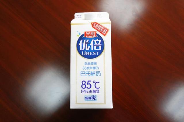 光明牛奶包装盒标注“85℃”被诉侵权 二审法院：属正当使用