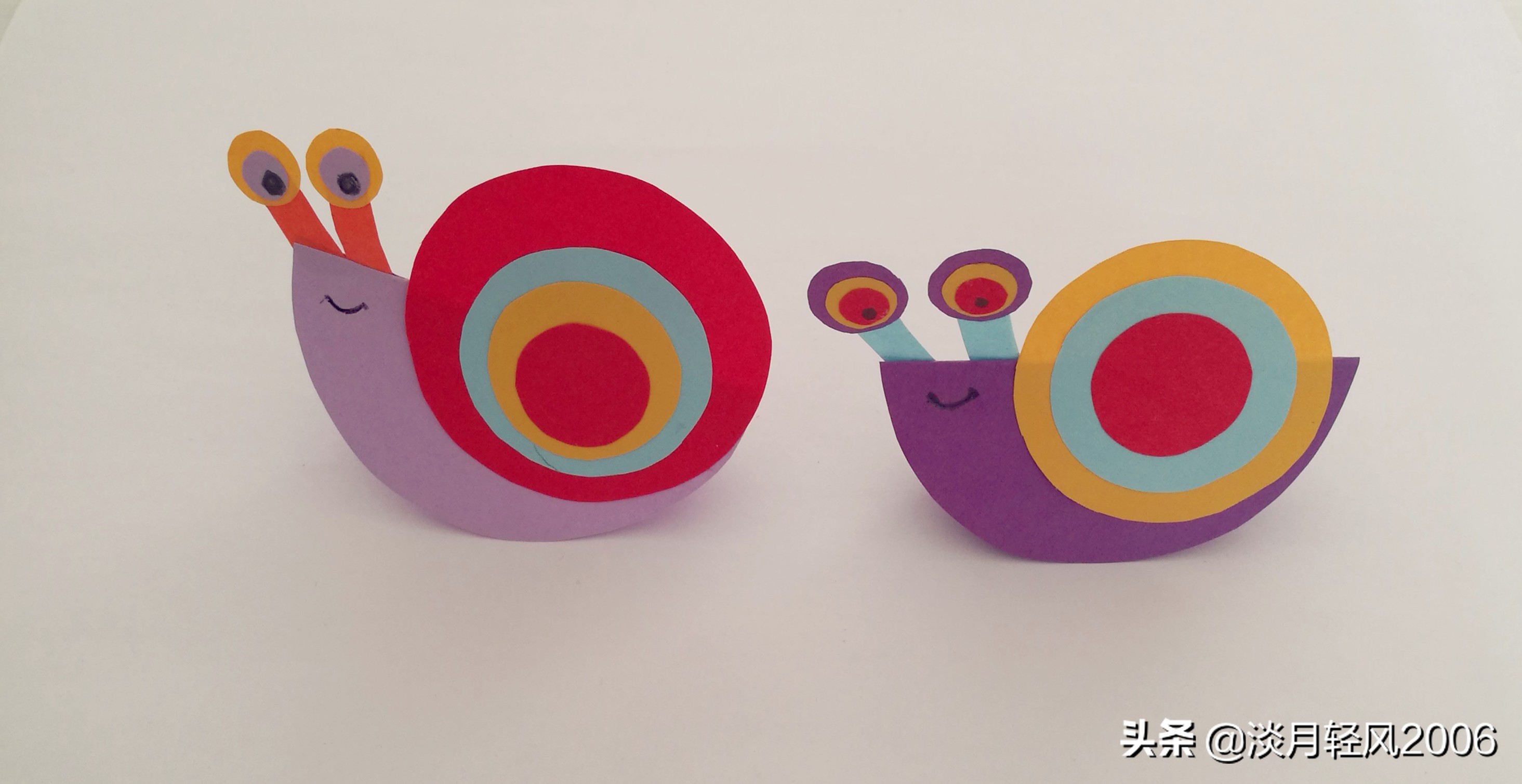 幼儿园亲子手工,用彩色卡纸剪10个圆两个长条,做出一个小蜗牛