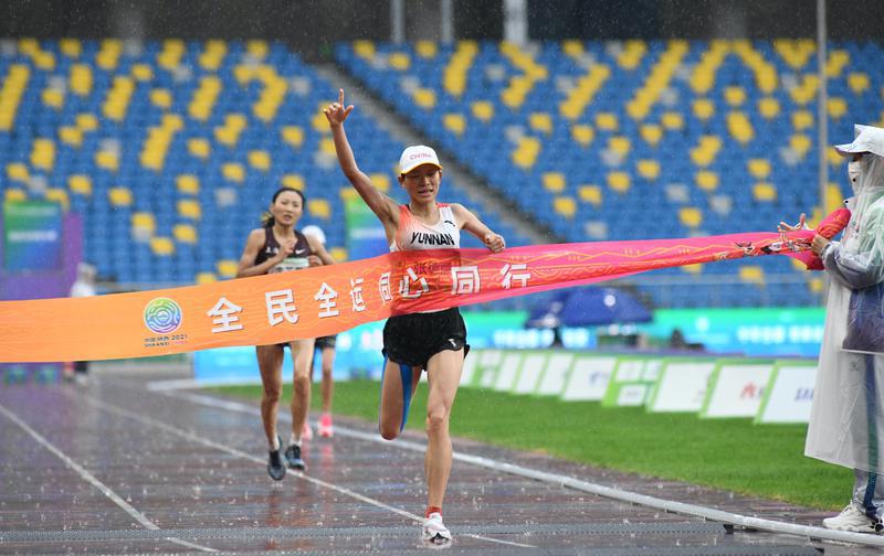 比赛集锦(风雨无阻精彩无限 十四运会马拉松比赛集锦)