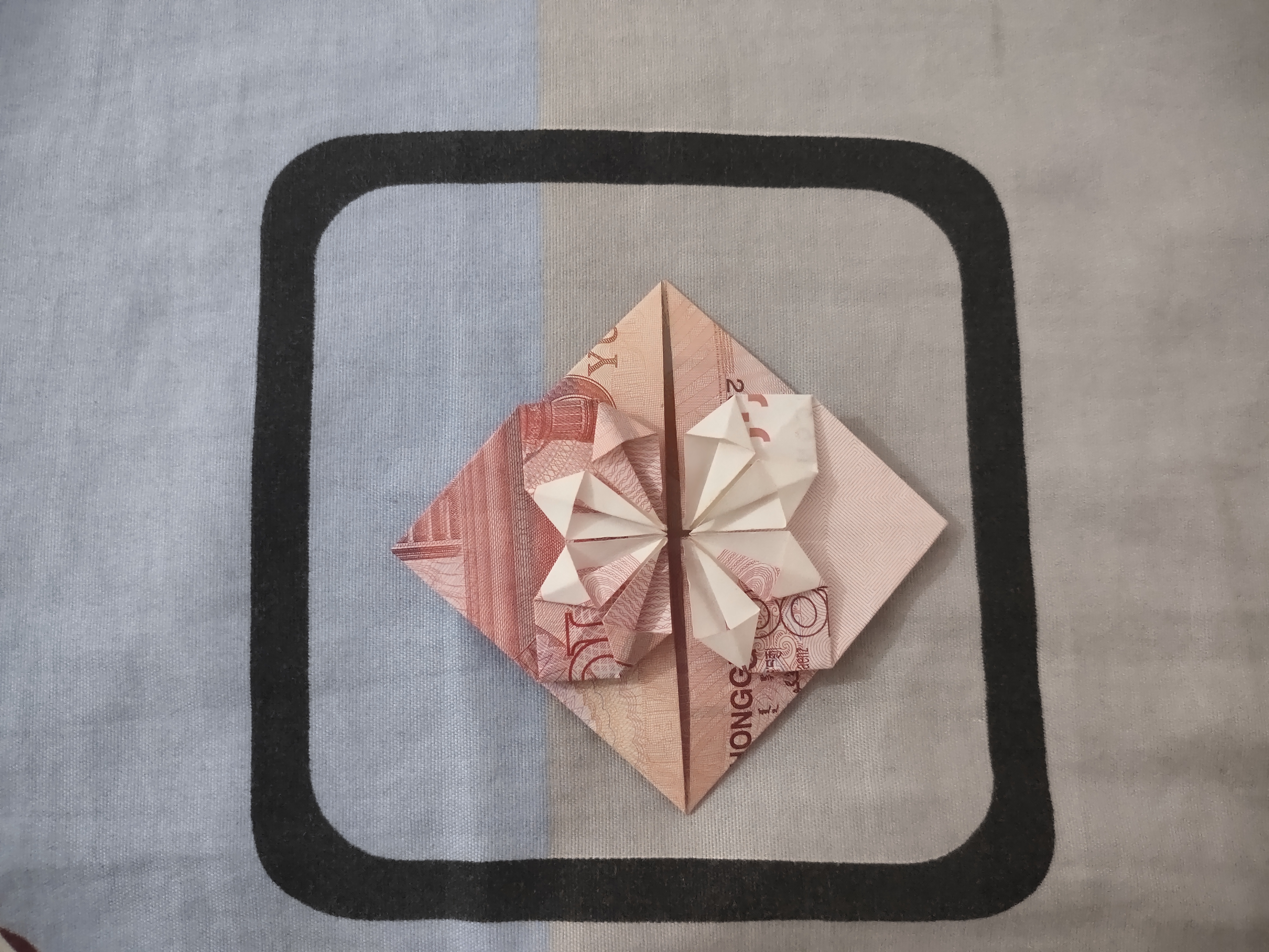 100元折爱心的步骤图解小朋友都能学会的教程